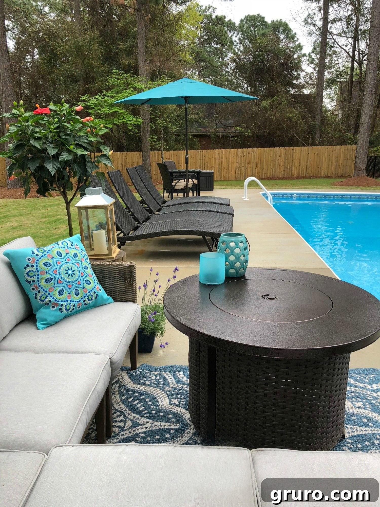 The versatile fire pit doubles as a practical table with comfortable seating around the poolside, perfect for gatherings.