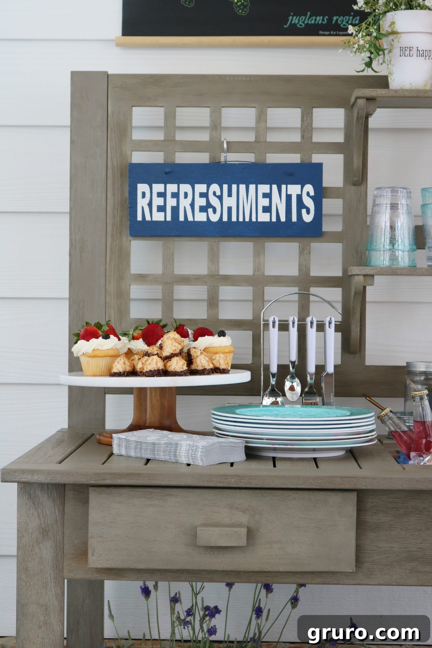 Better Homes & Gardens Camrose Potting Bench serving refreshments on a beautifully decorated back porch.