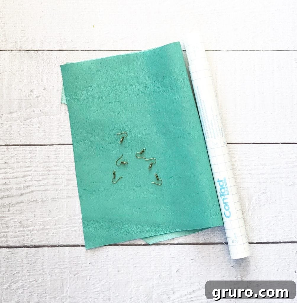 Gather Your Materials: All You Need to Make Leather Earrings with Cricut Crafting supplies including leather sheets for DIY earrings with a Cricut.