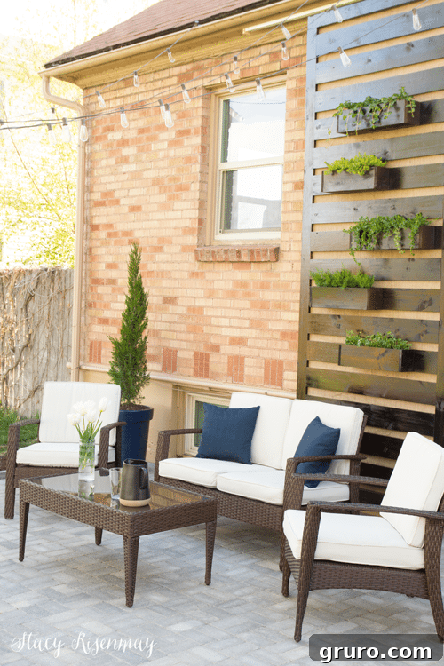 A beautifully laid DIY paver patio in a backyard setting, offering a perfect spot for outdoor relaxation and entertainment.