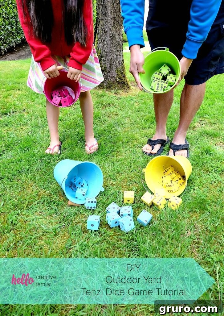 Large, colorful DIY Tenzi yard dice laid out on a lawn, ready for a fun outdoor game.