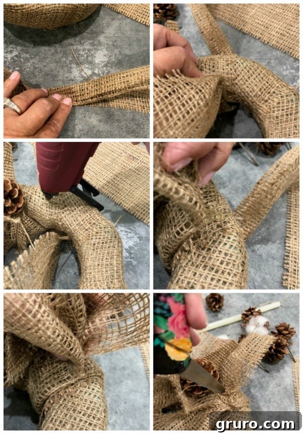 Folding and hot gluing burlap ribbon lengths onto a burlap-wrapped foam ring, strategically adding volume and texture for charming farmhouse decor
