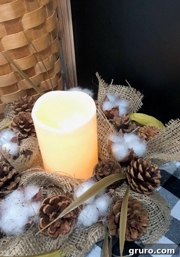 Dollar Store battery-operated candle elegantly positioned within a DIY farmhouse candle ring adorned with cotton and burlap, creating cozy home decor and a safe centerpiece