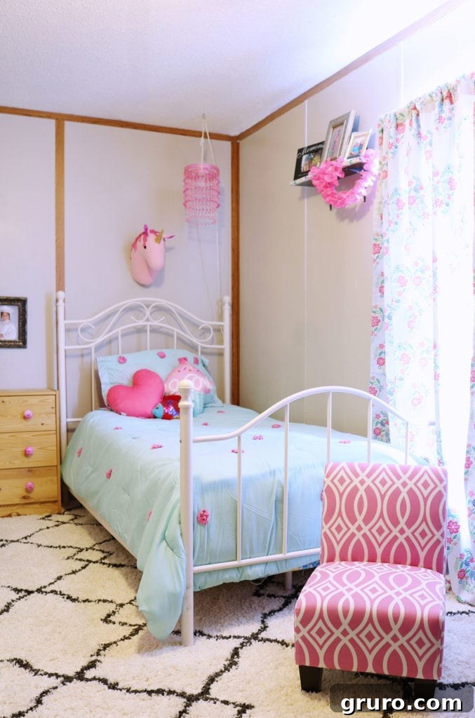Kids Room Refresh, affordable ideas to spruce up any space. Cute in pinks and blues. Girls Bedroom After, with pink and blue decor, showing refreshed space
