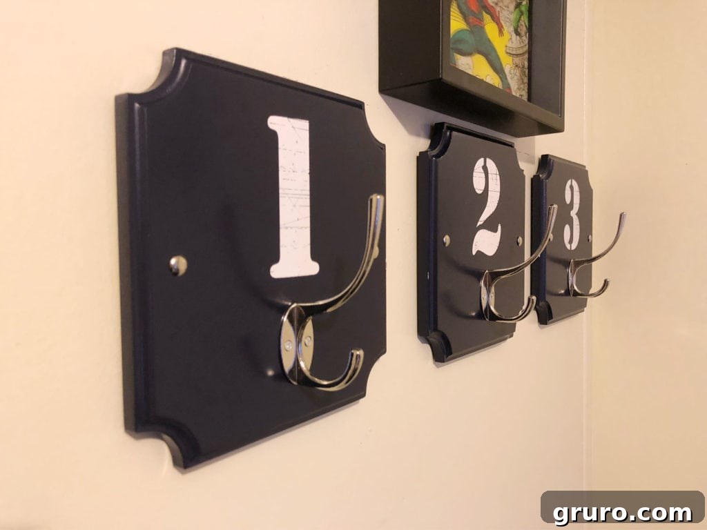 Numbered hooks for bedroom or any room. Navy and white, Kids Room Refresh, affordable ideas to spruce up any space. Numbered hooks for bedroom or any room decor