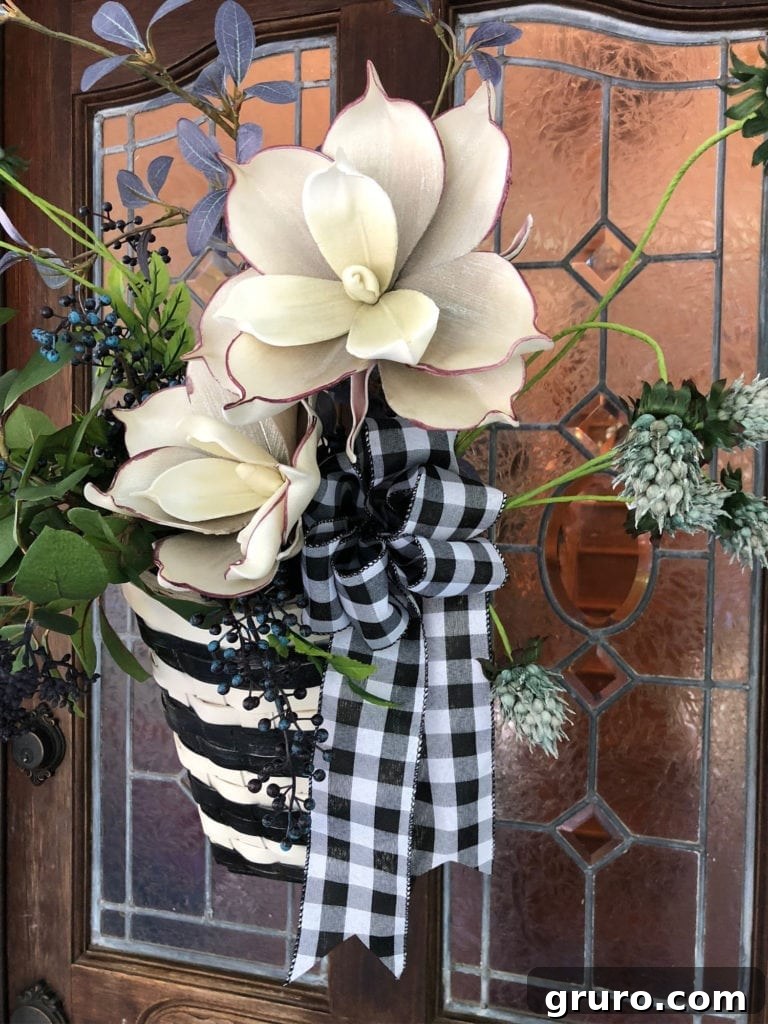 Thrift Store Basket Refresh: Easy DIY Front Door Decor Finished basket idea for front door decor with florals