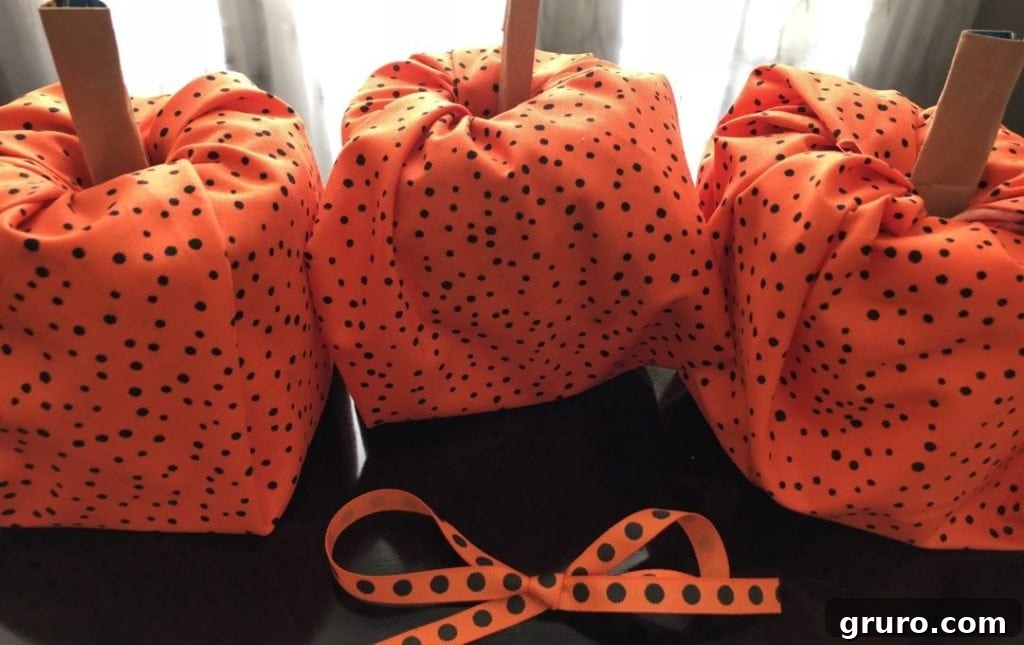 Toilet paper pumpkins wrapped in fabric