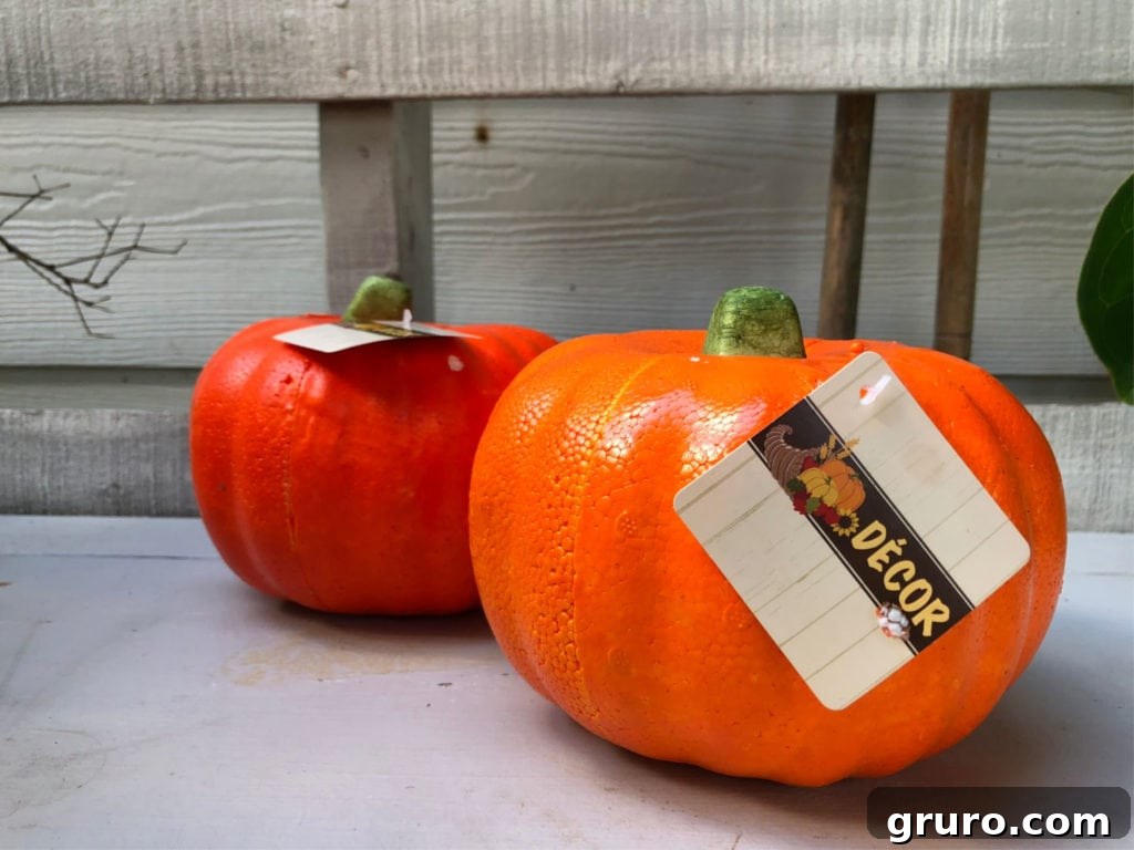 Dollar Store Foam Pumpkins transformed with Mod Podge and napkins for fall decor