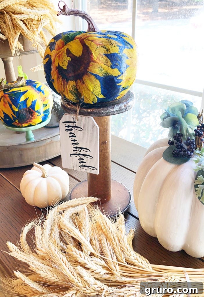 Close-up of Mod Podge pumpkin craft process, showing smooth application