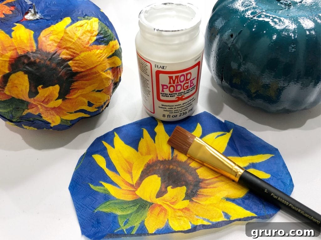 Beautiful Mod Podge napkins on a foam pumpkin, showcasing sunflower design