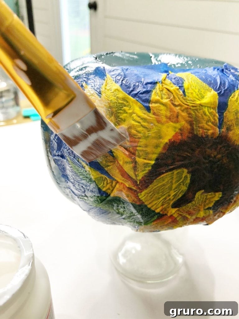 Mod Podge napkins on a blue foam pumpkin, showing varied results