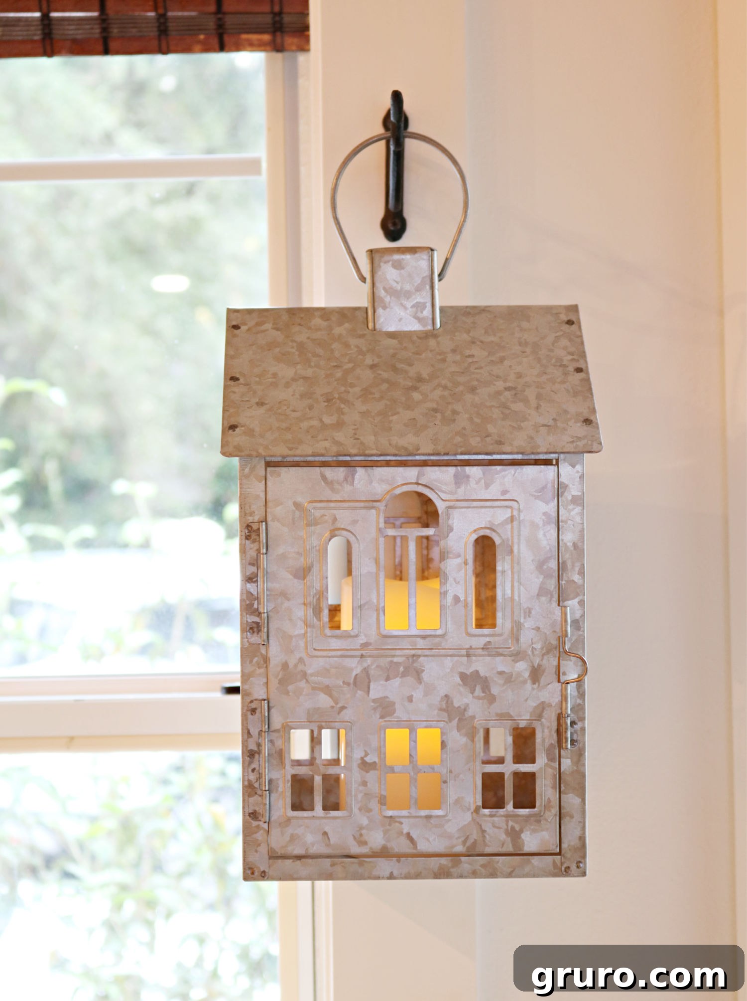 Galvanized farmhouse lantern detail Detailed view of a galvanized hanging farmhouse lantern, adding rustic charm