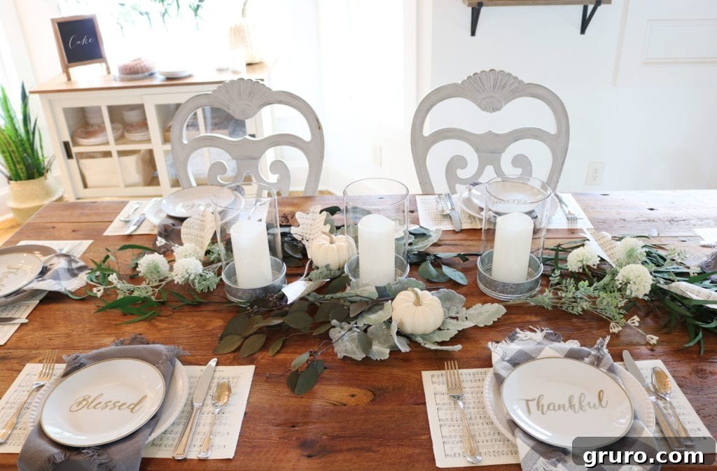 Barn wood dining table beautifully set for fall entertaining Farmhouse dining table adorned with fall decorations and a rustic tablescape