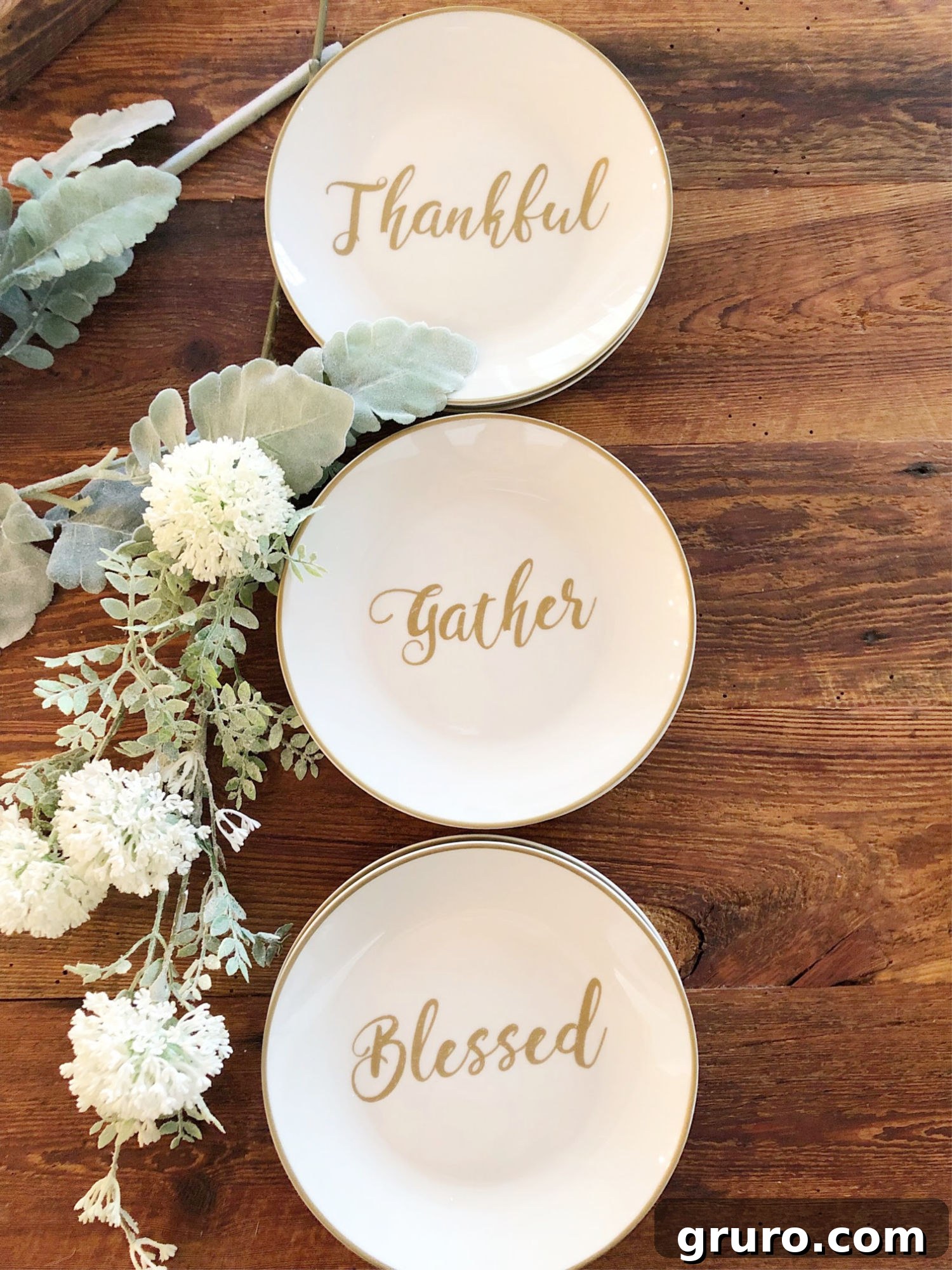 Charming farmhouse appetizer plates for seasonal dining Close-up of elegant appetizer plates with fall sentiments on a farmhouse dining table