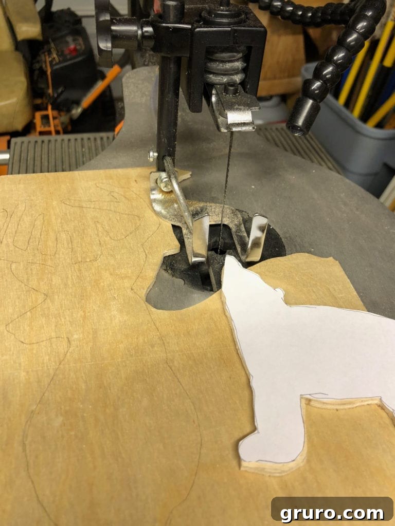Close-up of a precise scroll saw bear cutout, demonstrating the intricate details achievable for DIY Christmas signs.