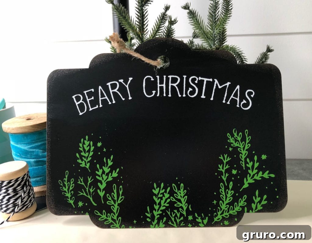 Adding a custom Chalk Couture design to a blank metal sign for a unique Christmas decoration.