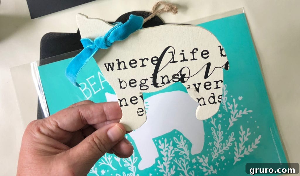 Painted bear cutout with custom text, ready to be attached to a Christmas sign, showcasing intricate scroll saw work and Chalk Couture transfers.