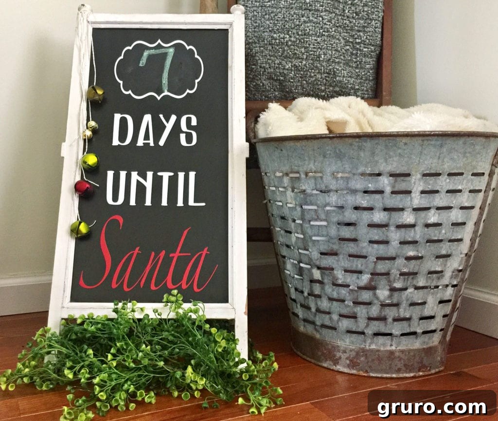 A beautifully crafted chalkboard sign displaying 'Days Until Santa' in vinyl lettering, ready for a Christmas countdown.