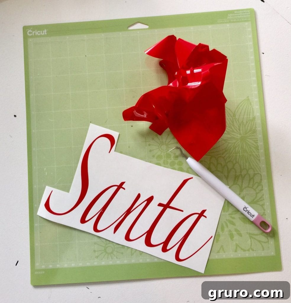 Vinyl design for Santa countdown applied to a chalkboard.