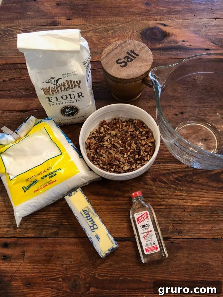 Ingredients laid out for Pecan Snowball Cookies recipe