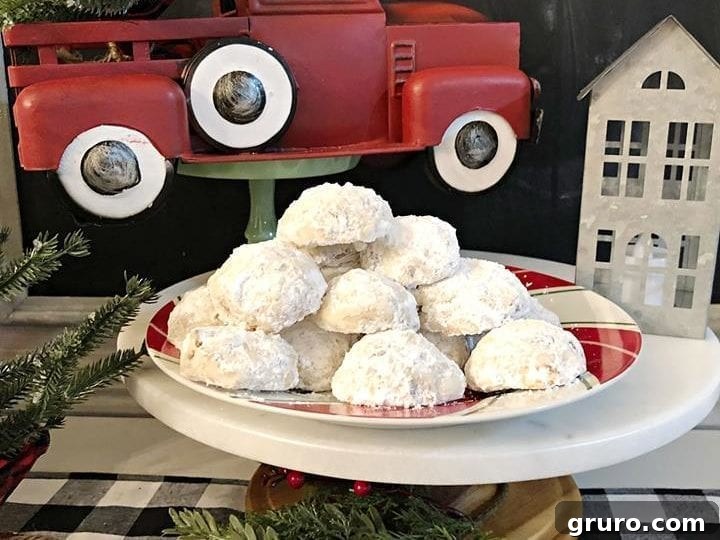 Beautifully coated Pecan Snowball Cookies with Lemon