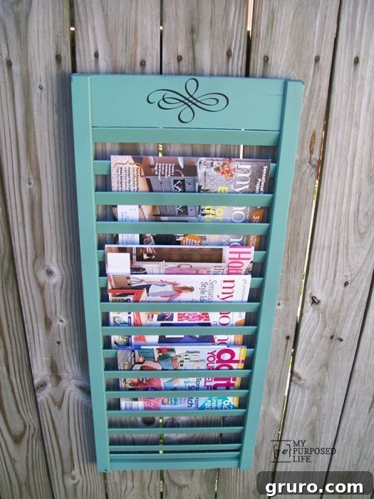 100+ Thrift Store Makeovers - like this shutter magazine rack. Repurposed Shutter Magazine Rack - A creative thrift store makeover turning an old shutter into functional and stylish storage.