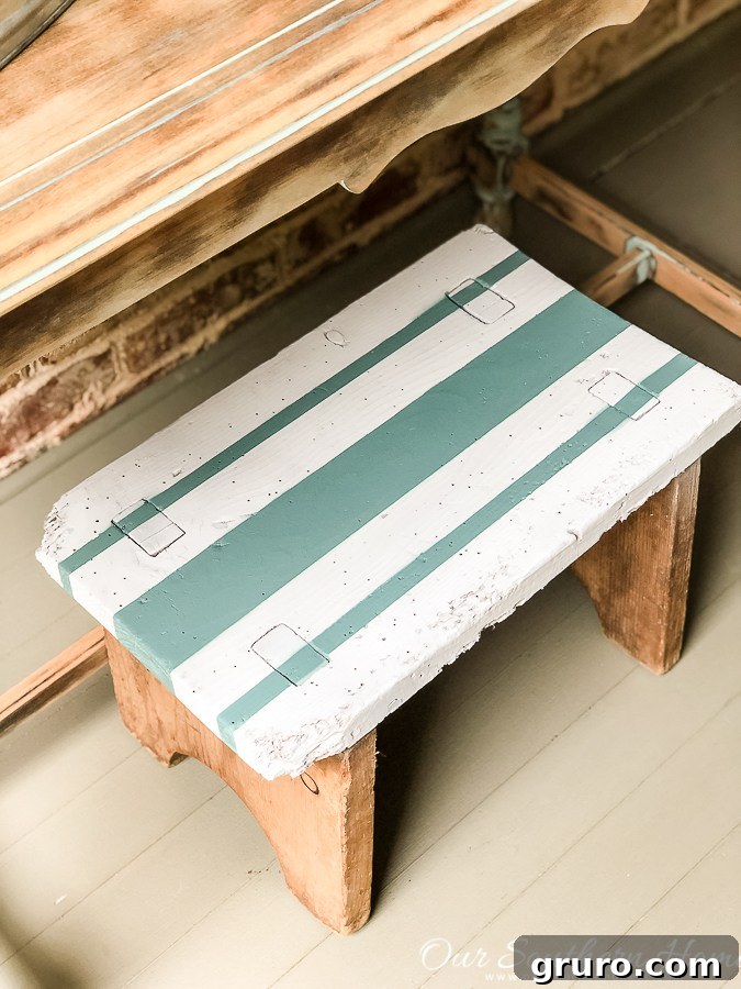 100+ Thrift Store Makeovers - trash to treasure stool Striped Stool Makeover - A thrift store stool gets a stylish update with paint and a striking striped pattern for modern home decor.