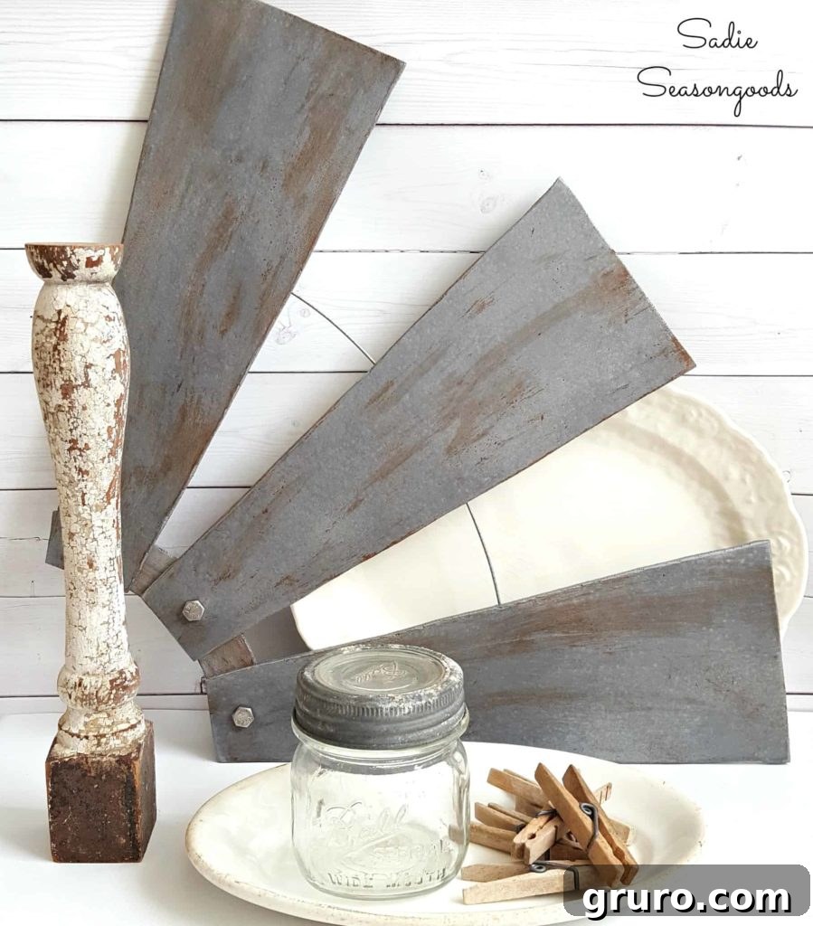 100+ Thrift Store Makeovers - amazing idea!! Windmill Wall Decor from Ceiling Fan Blades - Ingenious thrift store makeover creating farmhouse-style wall art.
