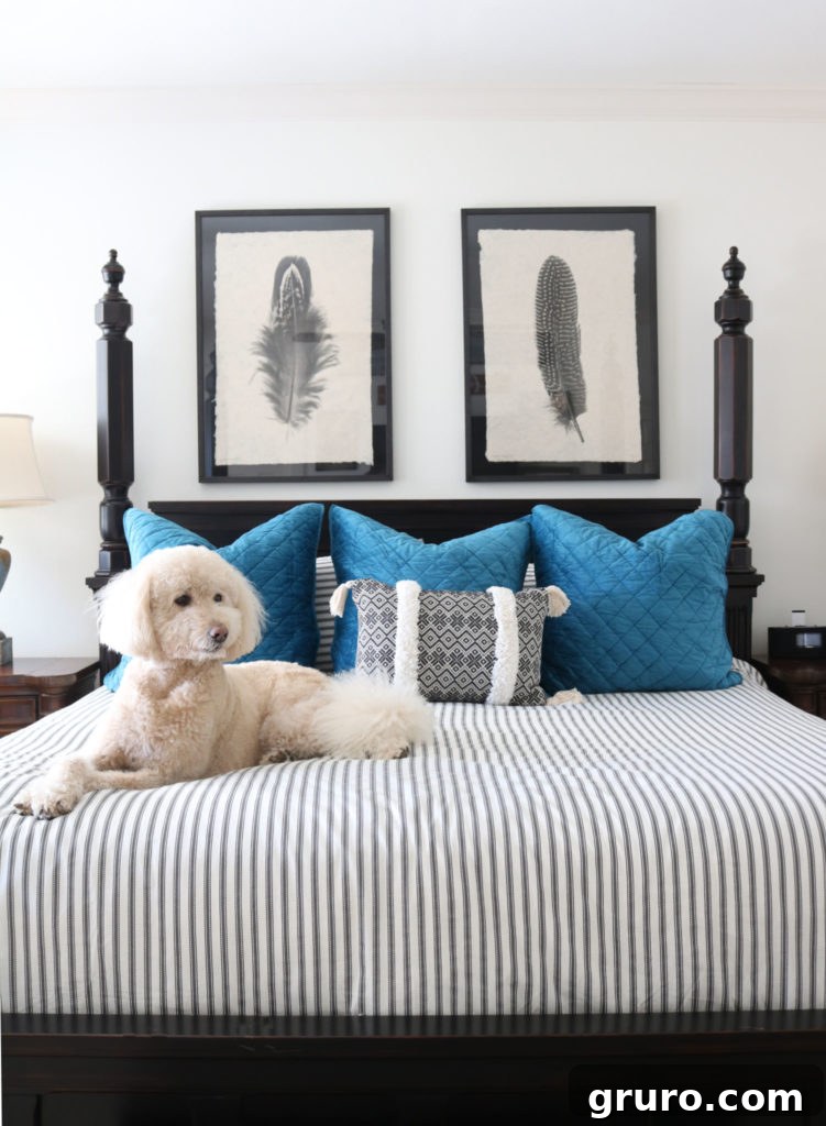 New bedding setup - striped duvet, linen sheets, and velvet Euro shams for a complete look.