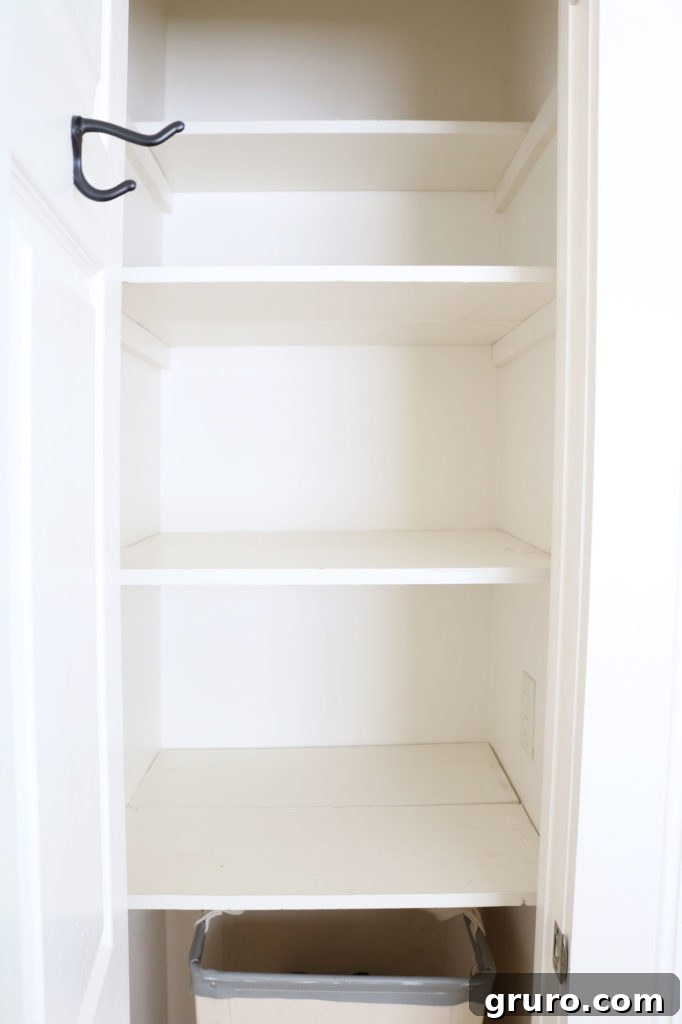 Empty towel storage shelves ready for organization
