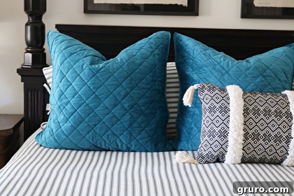 Euro shams with classic black and white striped bedding for a neutral bedroom refresh
