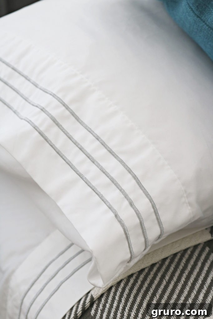 Modern Farmhouse Bedroom Makeover: Luxurious sheets BHG embroidered sheets adding luxury to the Modern Farmhouse Bedroom Makeover