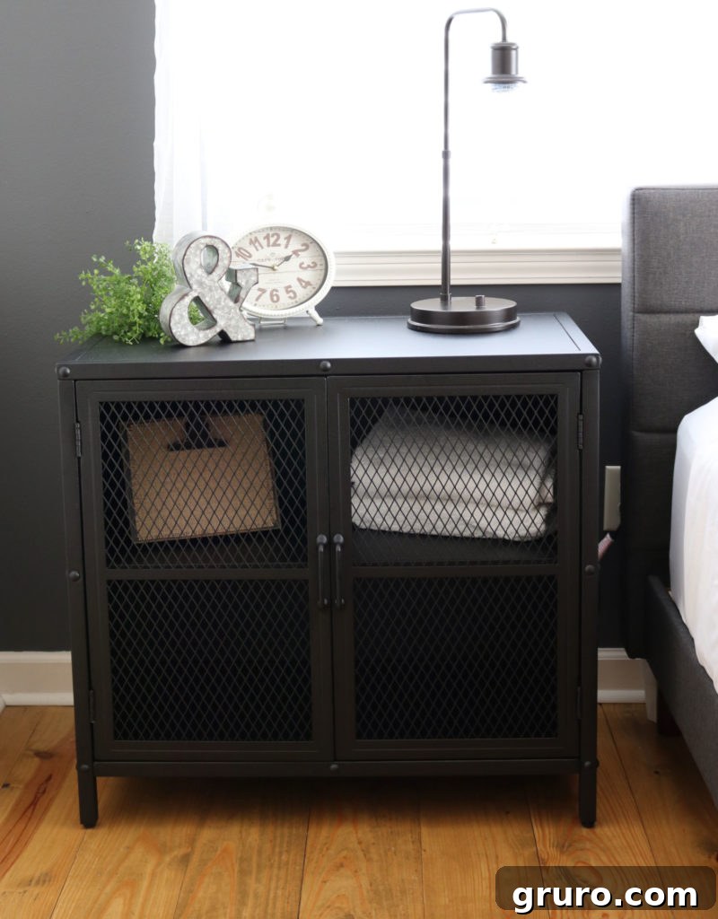 Modern Farmhouse Bedroom Makeover: Industrial accent cabinet Industrial cabinet providing stylish storage for a Modern Farmhouse Bedroom Makeover