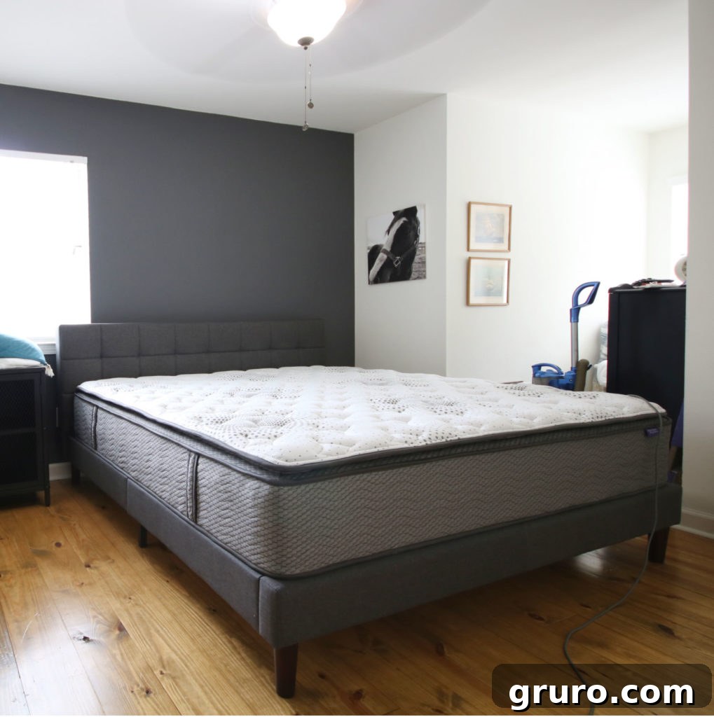 Modern Farmhouse Bedroom Makeover: Bed and Wall Color Reveal Process of setting up a comfortable mattress and bed frame for the Modern Farmhouse Bedroom Makeover