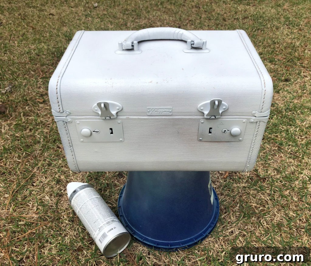 Vintage Train Case Makeover White train case with distressed finish, a simple spray paint project for vintage items