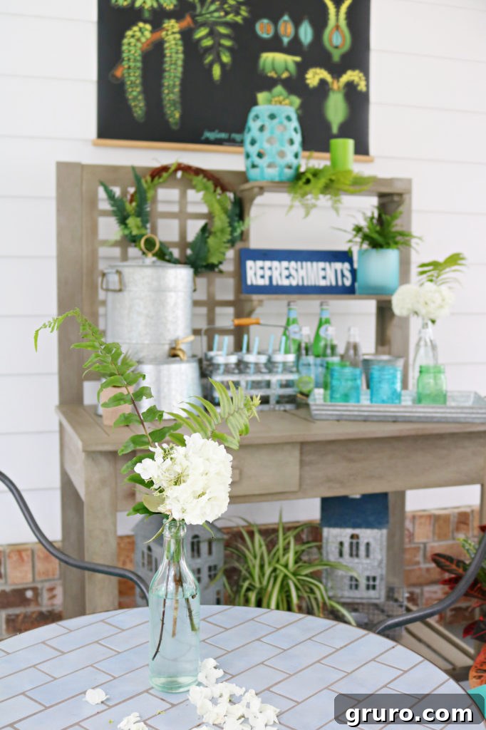 A close-up of the potting table beverage area on the porch, showing drinks and decor.