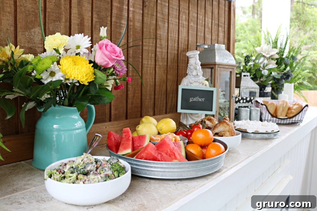 A generous food spread for a porch party, featuring a variety of dishes in a farmhouse buffet style.