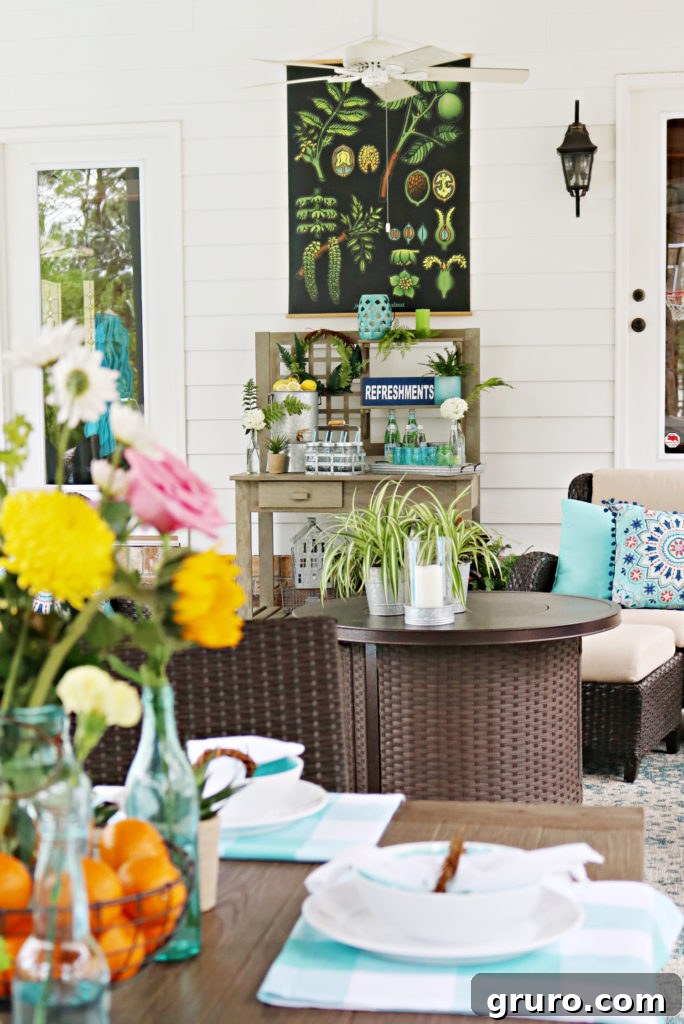 A well-organized covered porch dining area featuring a dedicated beverage station on a potting bench.