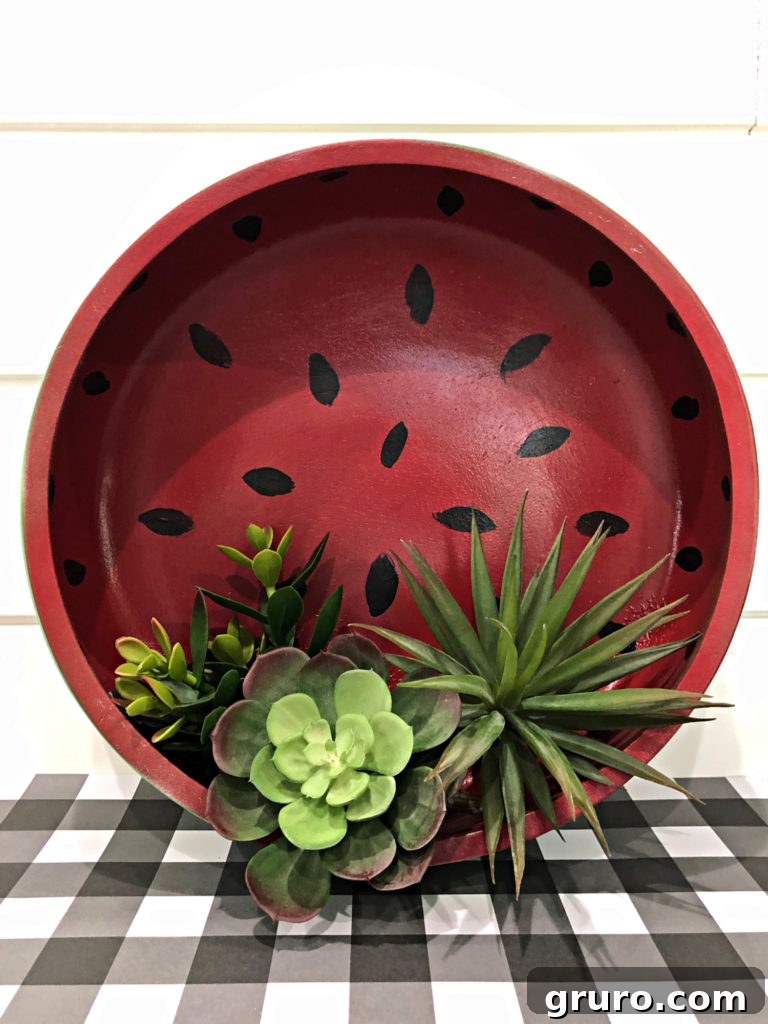 Finished vintage wood bowl transformed into a decorative watermelon