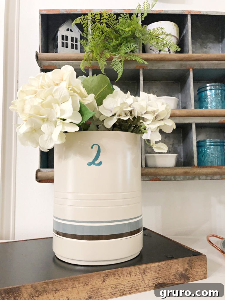 Rustic Crock Transformation 4 Thrifty idea for a DIY crock display with rolling pins and flowers