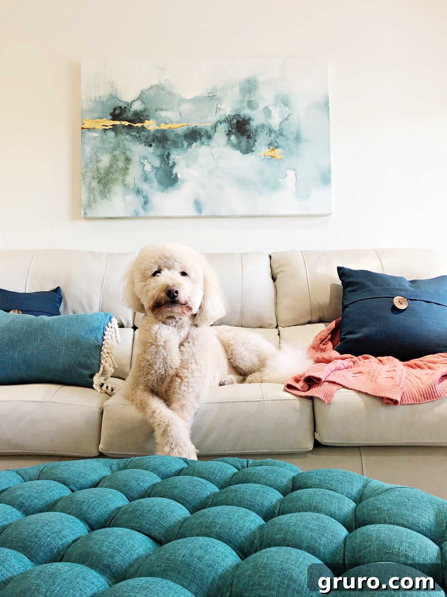 Stunning abstract art featuring teal tones and gold accents, perfect for modern coastal living room decor in a lake condo or beach house.