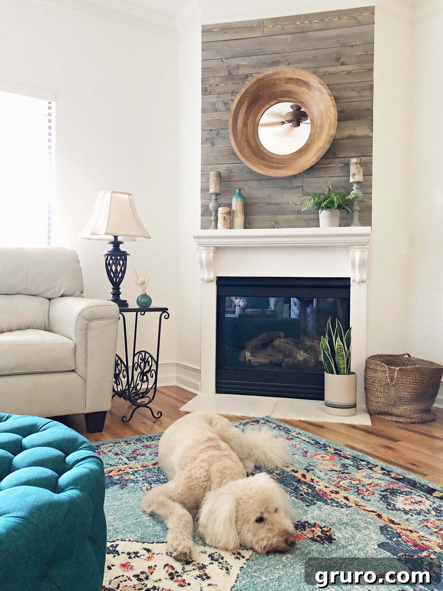 After image of a lake condo living room, showcasing a bright, refreshed space with elegant teal home decor ideas and natural light.