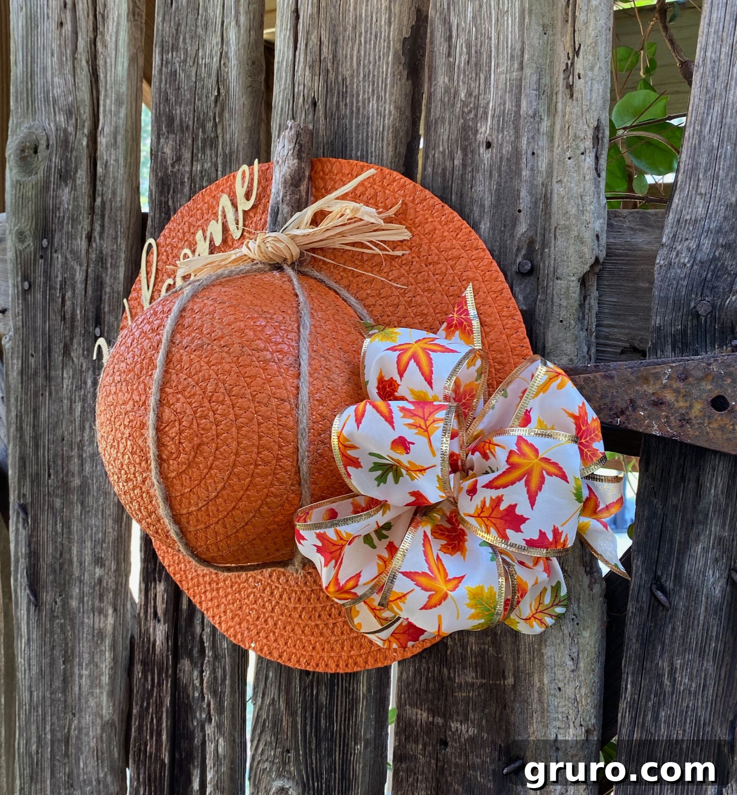 Warm Fall Pumpkin Door Welcome 8 Dollar Tree hat transformed into a charming pumpkin door hanger