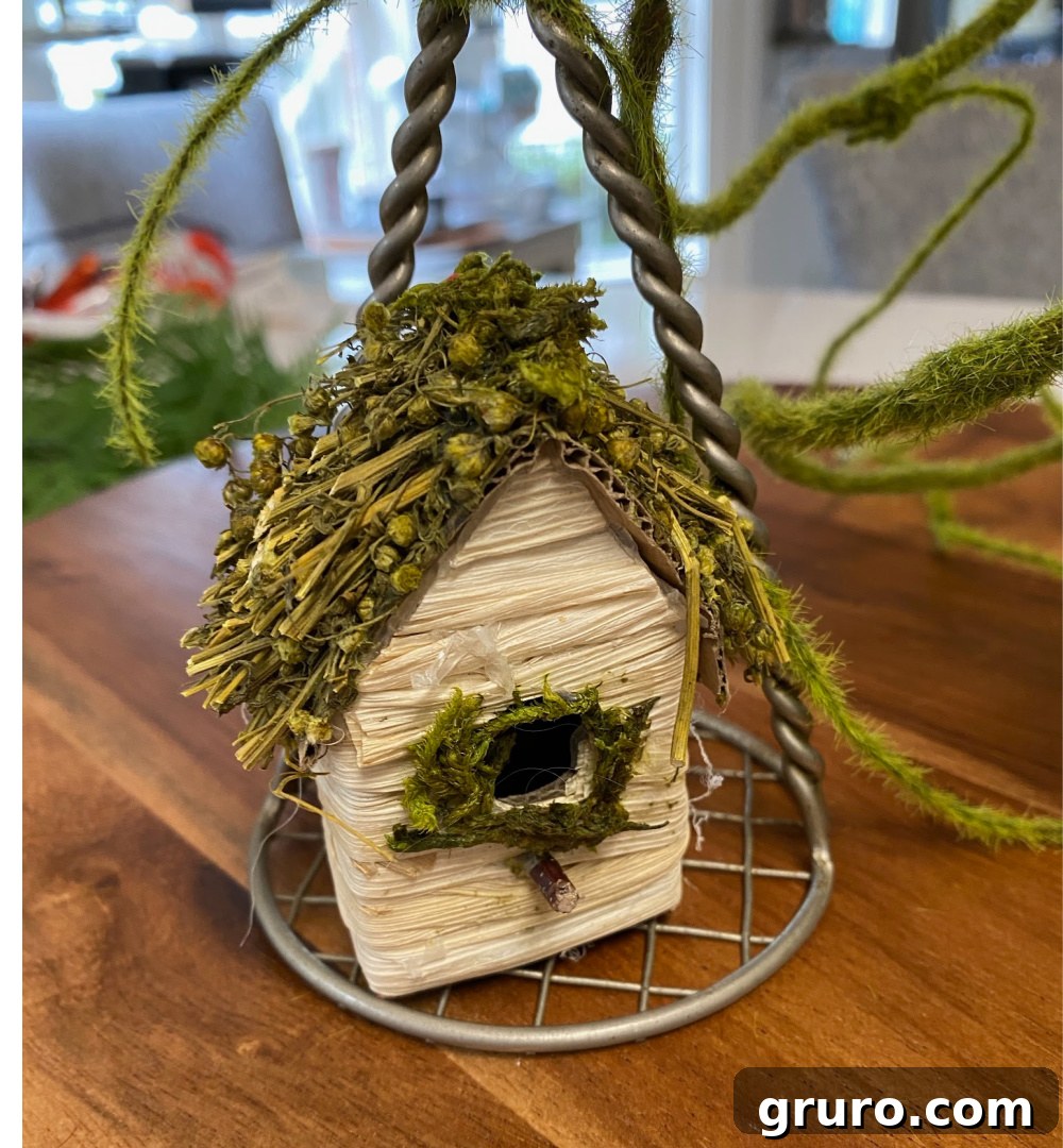 Birdhouse pick ready to be attached to a potato masher for spring decor
