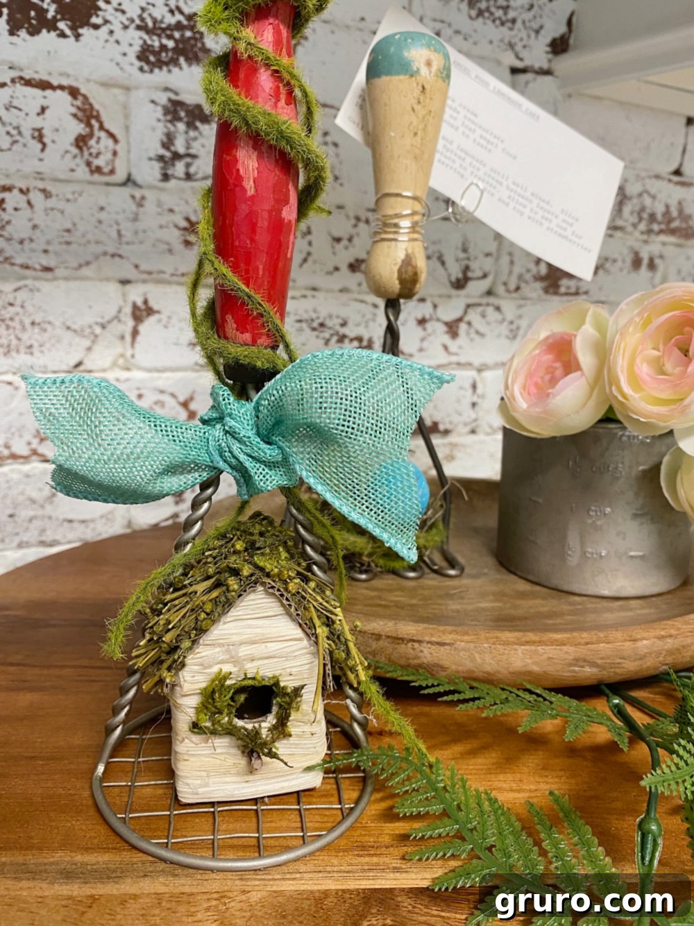 Antique kitchen utensil adorned with a decorative bow for spring