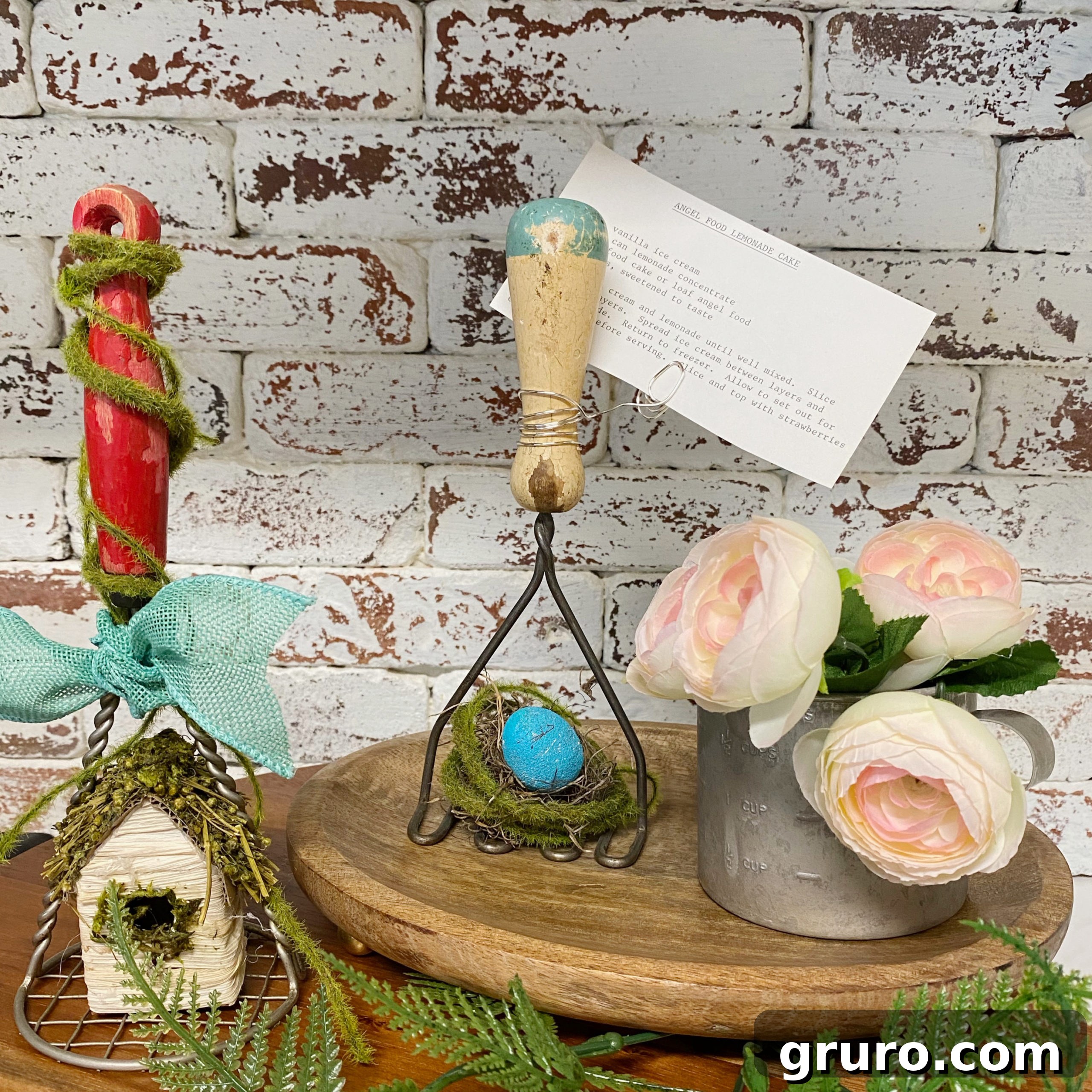 Beautiful display of antique kitchen tools transformed into spring themed decor