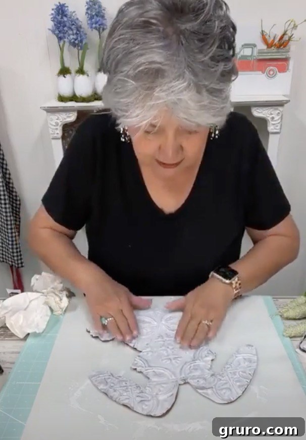 Hot gluing bunny tile to wooden cutout