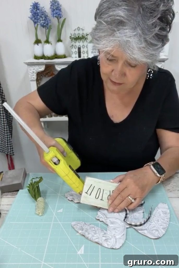 Hot gluing tag to bunny