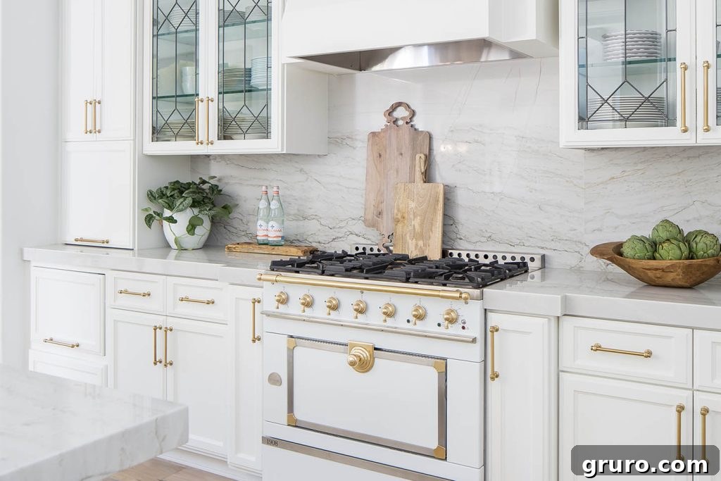 Elevating White Kitchens: 30 Backsplash Inspirations 10 Marble Slab Countertop to Backsplash