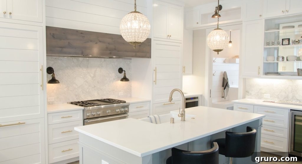 Elevating White Kitchens: 30 Backsplash Inspirations 11 Marble Slab Accent Backsplash in Kitchen